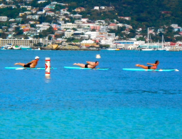 Dennis Hensley, doing yoga paddleboard in the Caribbean, reporting for ManAboutWorld gay travel magazine